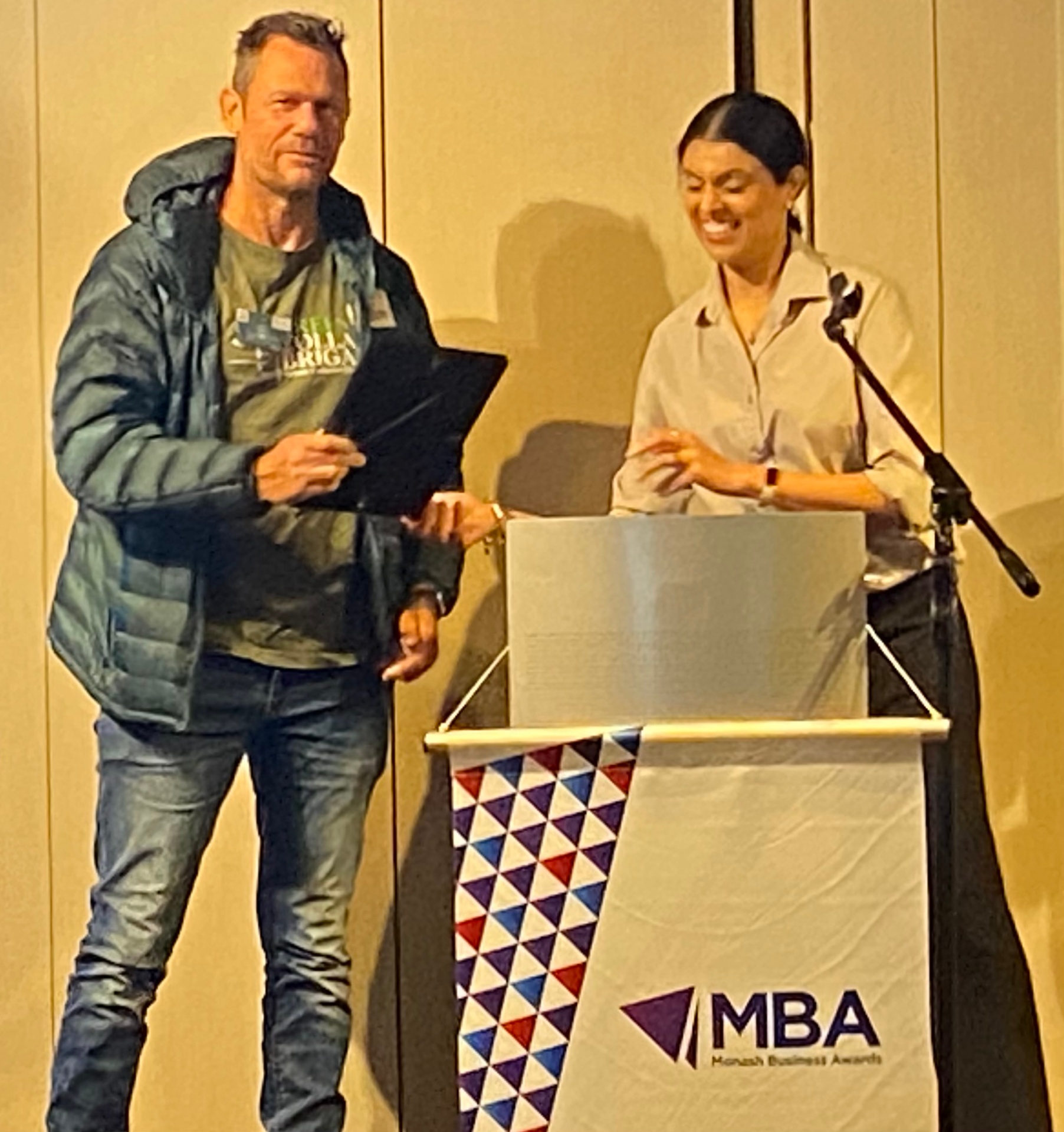Award presentation on stage at the Monash Business Awards