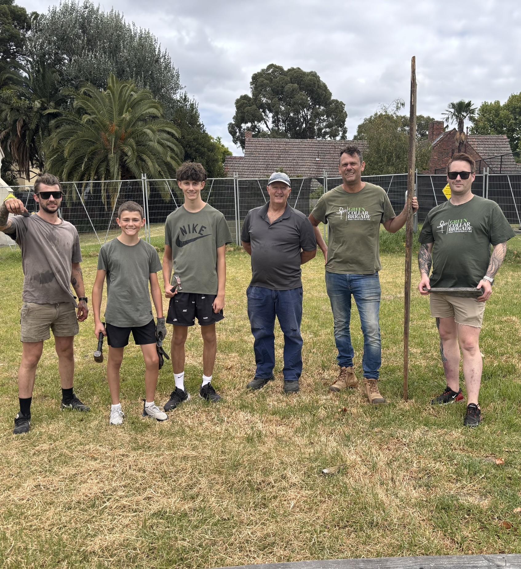 Brigade crew of all ages on a community fencing job
