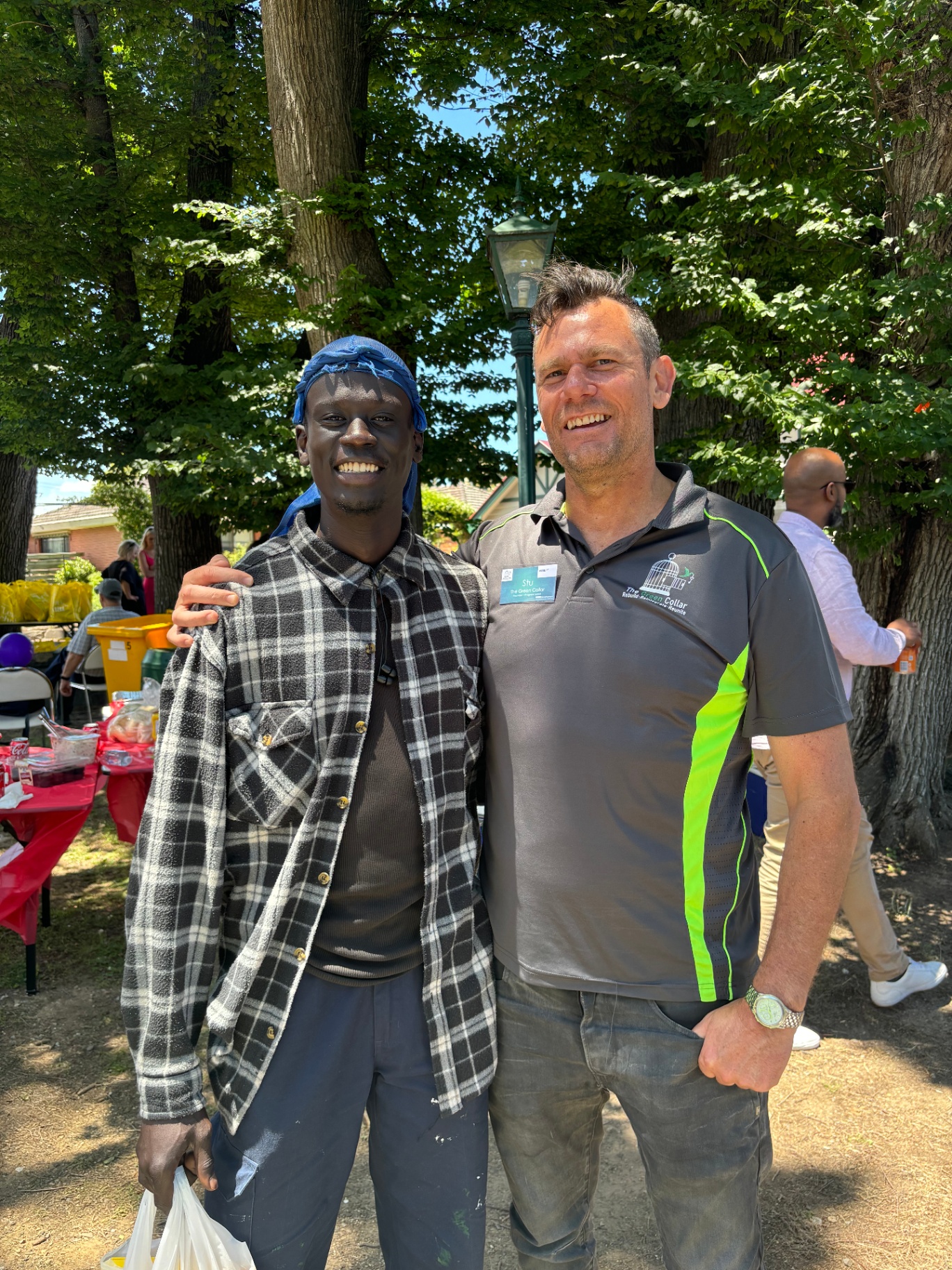 Stu and a Brigade member at a community day