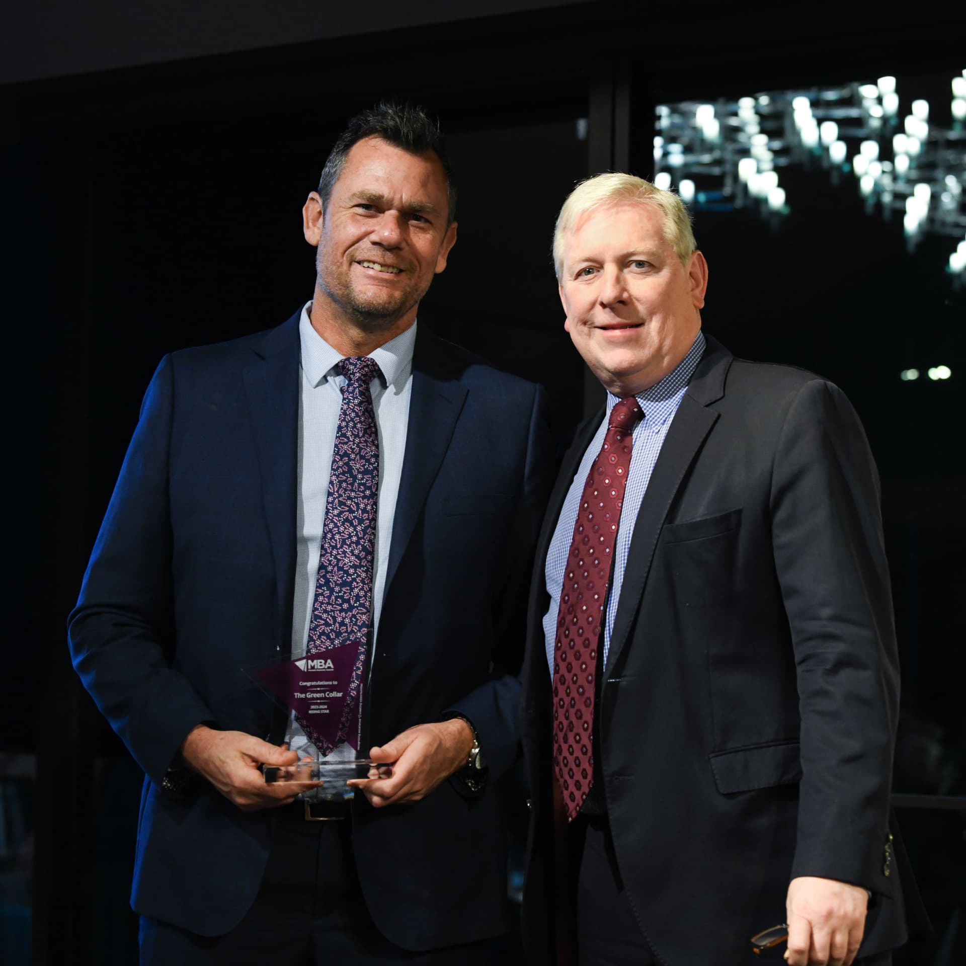 Stu Holmes receiving the Monash Business Awards Rising Star trophy