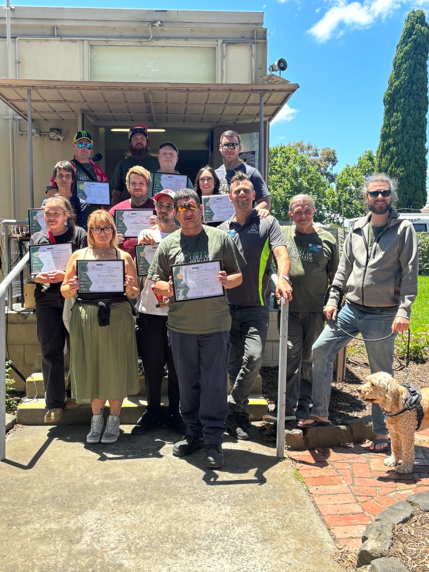 Brigade members holding their WISE Up annual award certificates