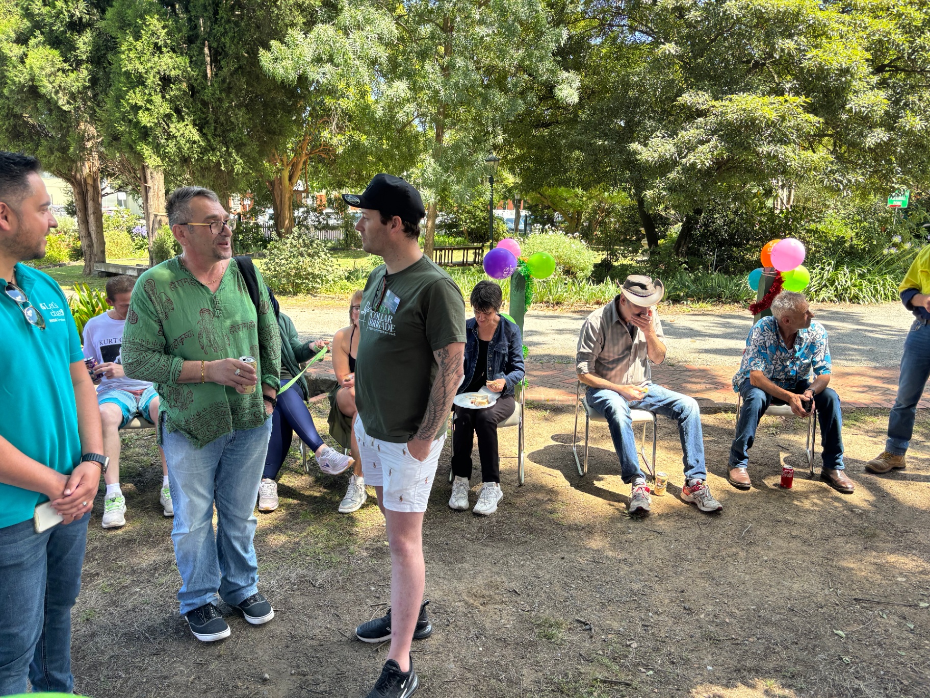 Community gathering with balloons and yarns